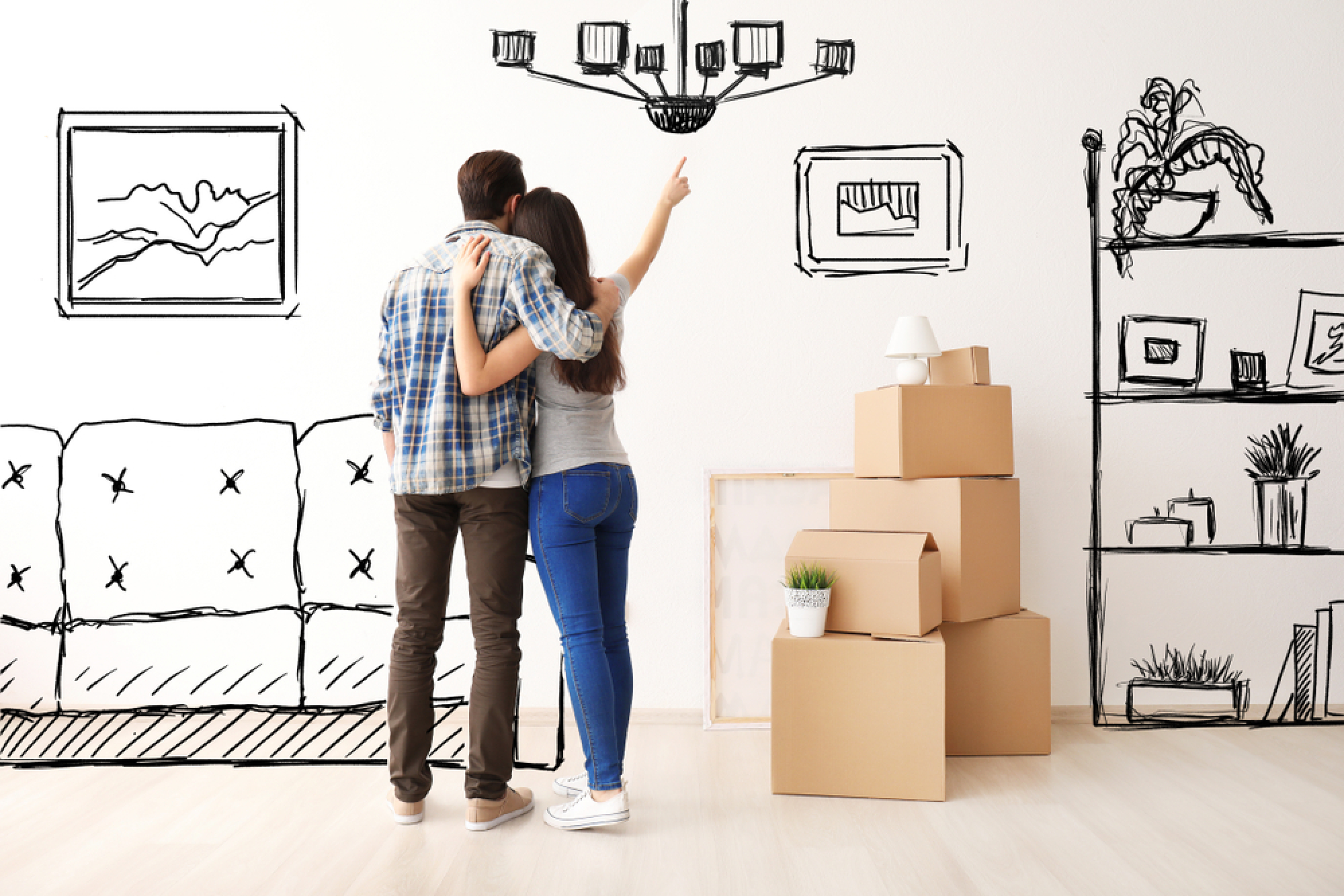 un couple se projette en dessinant des meubles sur les murs d’un appartement vide